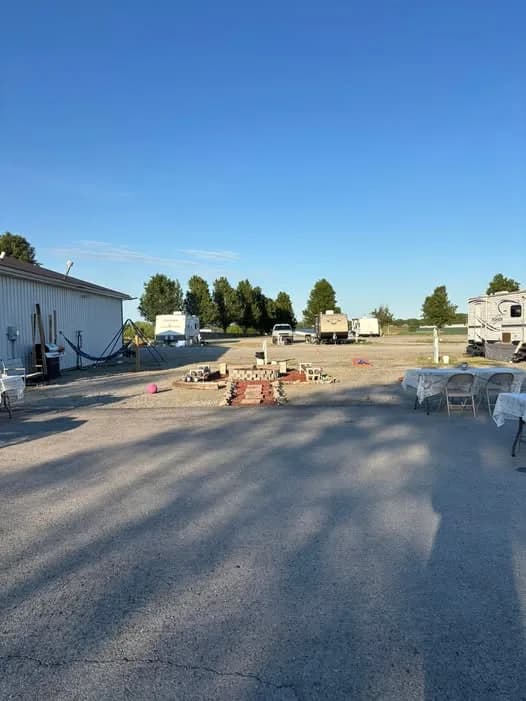 Guests gathered together outdoors at Heartland RV Park on a sunny afternoon in Campbellsville, KY